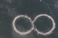 The infinity sign is drawn on the frozen surface of the lake.