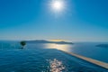 Infinity swimming pool water merges with Mediterranean Sea below