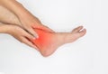 Inflammation of Asian young manÃ¢â¬â¢s ankle joint and foot. Concept of joint pain and leg problems