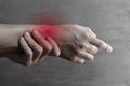 Inflammation of Asian man wrist joint and hand. Concept of joint pain and hand problems Royalty Free Stock Photo