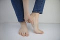 Woman suffering from heel pain. Inflammation or sprain of the tendon in the foot, heel spur, bursitis. The concept of diseases and