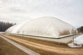 Inflatable air dome stadium. Inflated Football soccer air dome. Modern architecture example pneumatic stadium dome with Royalty Free Stock Photo