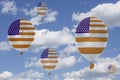Inflatable balloons with USA flag in blue sky and clouds Royalty Free Stock Photo
