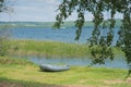 Inflatable boat on lake shore Royalty Free Stock Photo