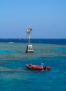 inflatable boat with sailors to provide divers near a coral reef in the Red Sea, Egypt Royalty Free Stock Photo