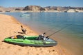 A rubber dinghy pulled up on the sand at Lake Powell Royalty Free Stock Photo