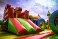 Inflatable castle labirynth slide in a playground against the blue sky