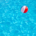 Inflatable colorful ball floating in swimming pool