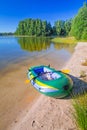 Inflatable dinghy at the summer lake Royalty Free Stock Photo