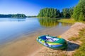 Inflatable dinghy at the summer lake Royalty Free Stock Photo