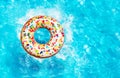 Inflatable doughnut buoy splash in a pool top view Royalty Free Stock Photo