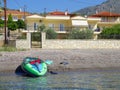 Inflatable Kayak on Pebbly Gulf of Corinth Beach, Greece