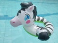 Inflatable kid's lifebuoy in the shape of a zebra.