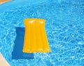 Inflatable mattress floating in the pool Royalty Free Stock Photo