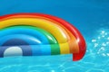 Inflatable mattress floating in swimming pool Royalty Free Stock Photo