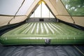 inflatable mattress inside a tent for camping