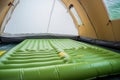 inflatable mattress inside a tent for camping