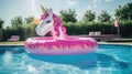 An inflatable mattress in shape of unicorn on the surface of the pool. Summer Royalty Free Stock Photo