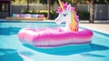 An inflatable mattress in shape of unicorn on the surface of the pool. Summer Royalty Free Stock Photo