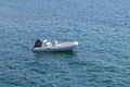 Inflatable motor boat at sea at anchor Royalty Free Stock Photo