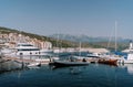 Inflatable motor boats stand next to yachts at the marina berths Royalty Free Stock Photo