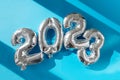 Inflatable New Year balloons 2023 sunshine's bright light Royalty Free Stock Photo