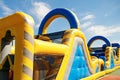 Inflatable obstacle course slide for kid games or team building outdoor activities Royalty Free Stock Photo