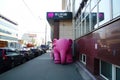 Inflatable pink elephant in front of the club entrance