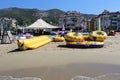 Inflatable rafts for entertainment of resting people lie on the sandy shore of the Mediterranean Sea