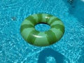 Inflatable ring floating in pool on sunny day Royalty Free Stock Photo