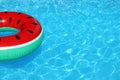 Inflatable ring floating in swimming pool on sunny day Royalty Free Stock Photo