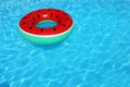 Inflatable ring floating in swimming pool on sunny day Royalty Free Stock Photo