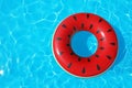 Inflatable ring floating in swimming pool on sunny day, top view with space Royalty Free Stock Photo