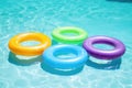 Inflatable rings floating on the surface of a swimming pool, perfect for summer fun or a backyard party Royalty Free Stock Photo