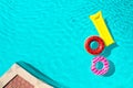 Inflatable rings and mattress floating in swimming pool, space for text. Summer vacation Royalty Free Stock Photo