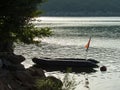 Inflatable rubber boat on the lake at the sunset