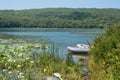 Inflatable rubber boats anchored near lake shore. Royalty Free Stock Photo