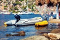 A inflatable rubber motor boat and a kayak on the sea Royalty Free Stock Photo