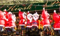 Inflatable Santa Claus hanging on a rope