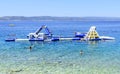 Inflatable slide on the sea. Brela, Croatia.