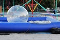 Inflatable small balloon for children on the water in pool. The ball in the water - fascinating summer attractions for children. W Royalty Free Stock Photo