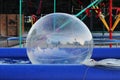 Inflatable small balloon for children on the water in pool. The ball in the water - fascinating summer attractions for children. W Royalty Free Stock Photo