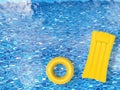 Inflatable toys floating on pool top view Royalty Free Stock Photo