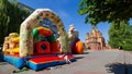 Inflatable trampoline in downtown square, Alexander Nevsky moscow patriarchate russian orthodox church, Zhmerynka, Ukraine