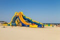 Inflatable water slide on beach of Azov sea