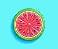 Inflatable watermelon slice isolated on blue background