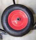 Inflatable wheel for a garden wheelbarrow with a red metal disk, inventory, garden equipment Royalty Free Stock Photo