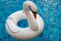 Inflatable white swan in the pool