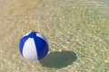 Inflatble beach ball floating on water Royalty Free Stock Photo