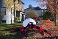 An inflated balloon spider is the Halloween decoration in the front yard